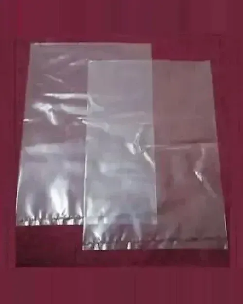 Two clear plastic bags of different sizes, overlapping, on a maroon background.